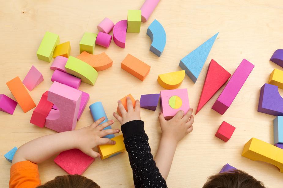 Children sharing and playing with toys